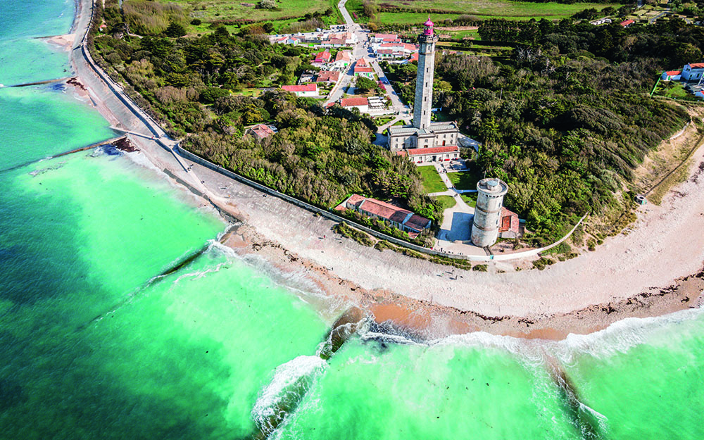 Overhead view of a coastline with turquoise waters