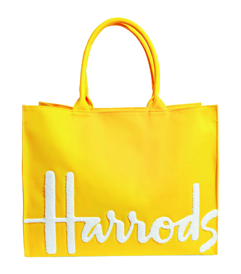 A yellow Harrods tote bag